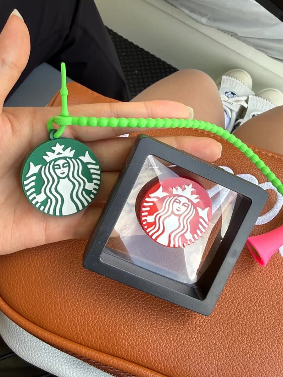 Cute doll-topped golf tee received during the round
