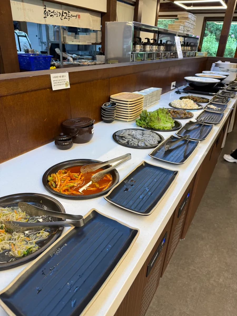 Self-service banchan bar with extra side dishes at the Baegun Lake grilled fish restaurant