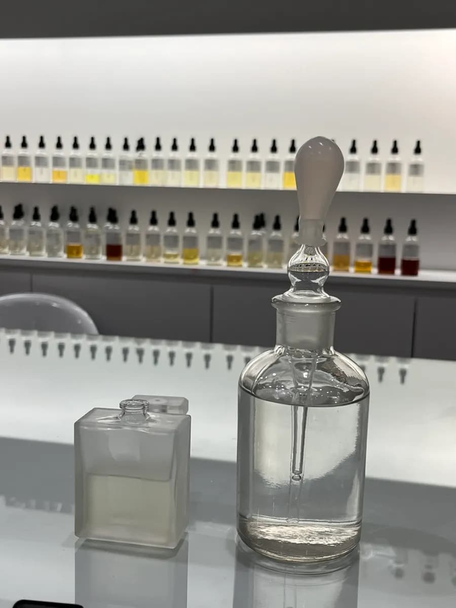 Filling the selected perfume bottle with scent and perfume base