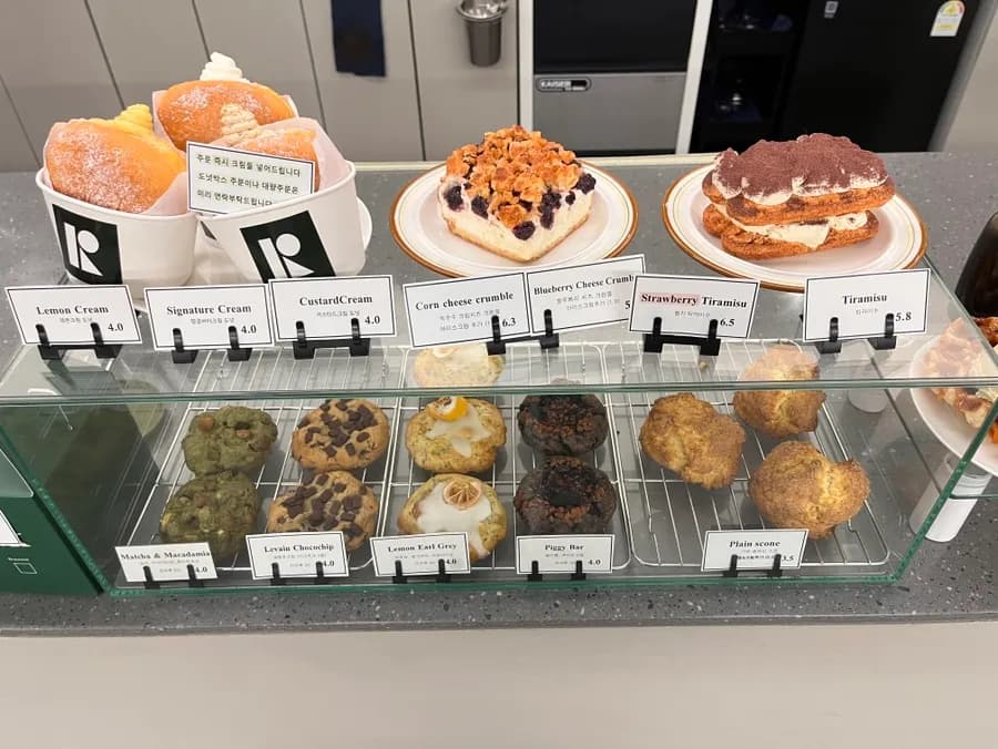 Dessert display and cafe menu at Ritthing Coffee