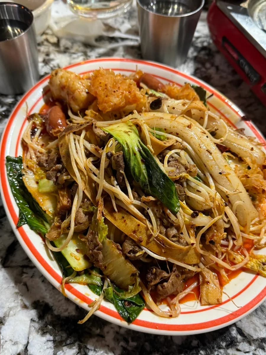 Food photo from Myoun in Mullae after ordering minari suji-tang and mala xiangguo