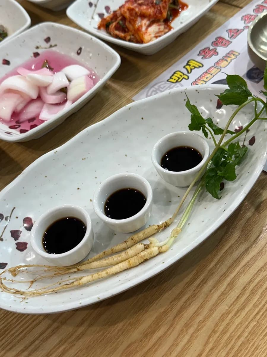 Black goat extract served before the meal at Baekse Heukyeomso Chueotang