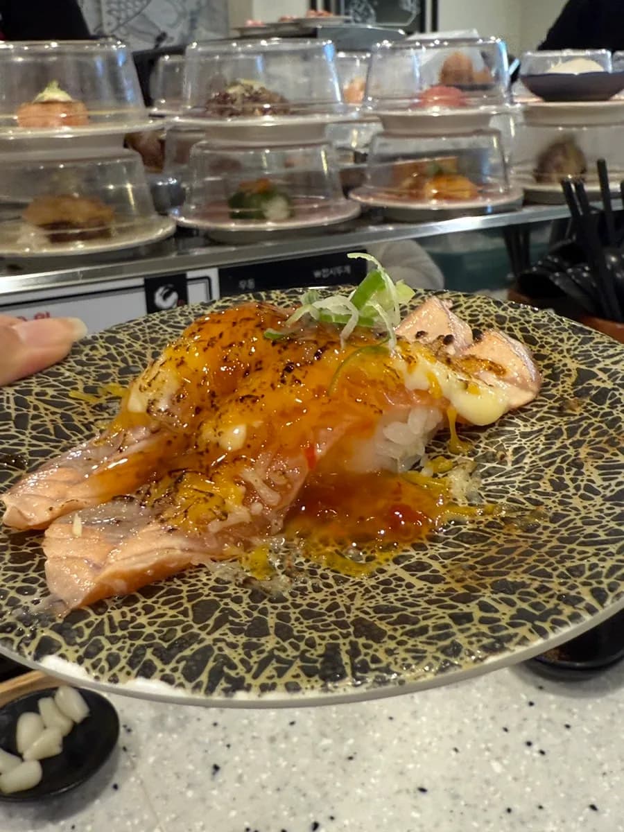 Favorite sushi plates at Sushino Yuki with egg, shrimp, cheese, and salmon