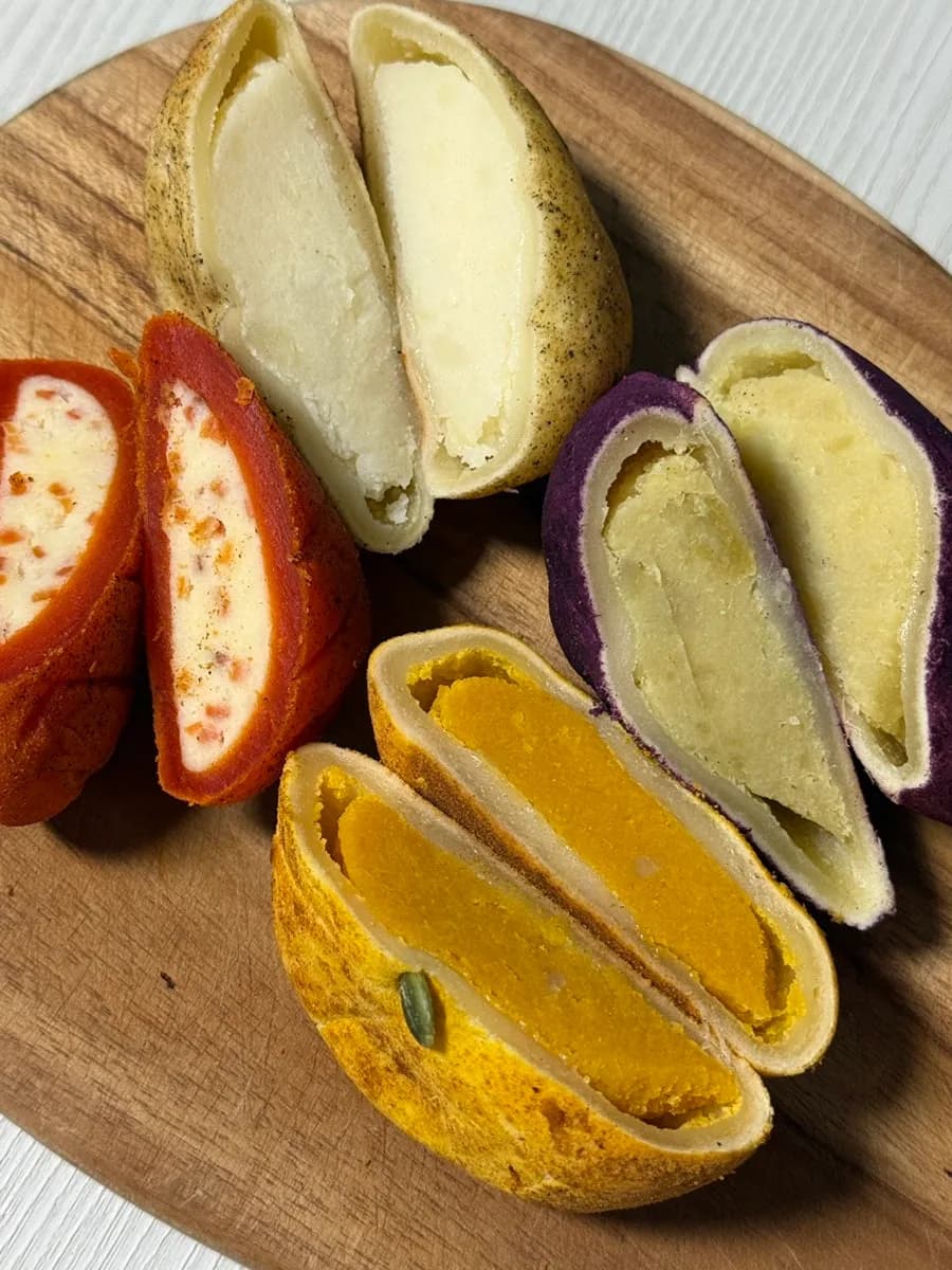 Cut-open crop-shaped bread showing the filling