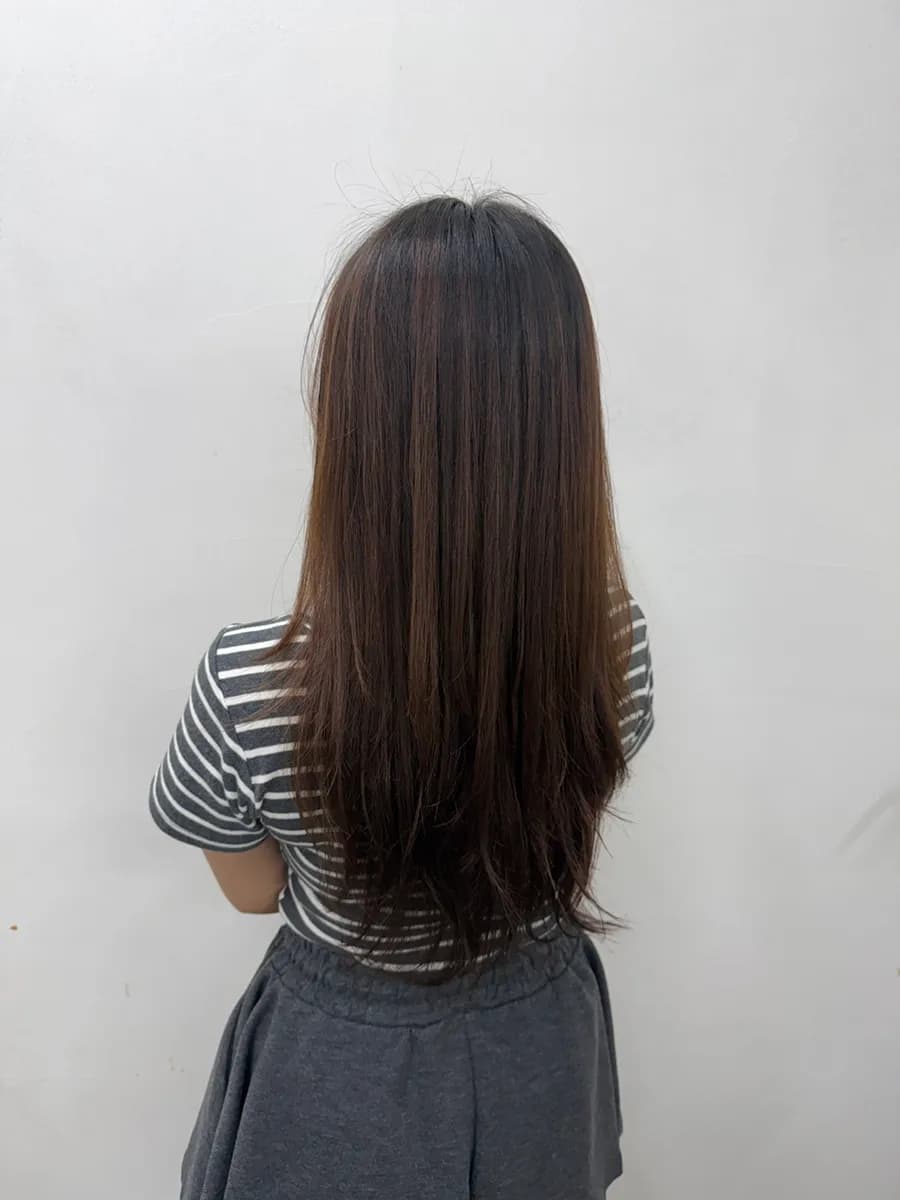 Finished layered cut and smoother hair after the clinic treatment