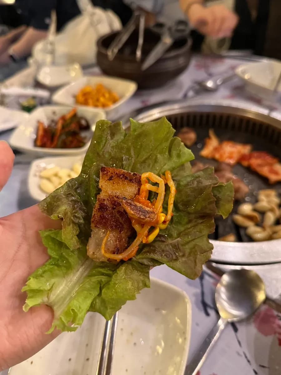 Korean BBQ lettuce wrap with bean sprouts and garlic
