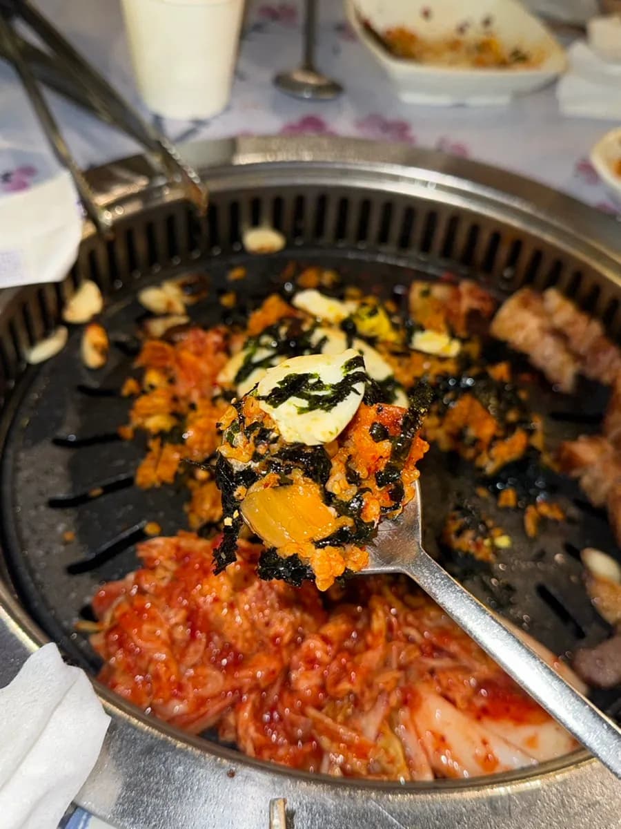 Kimchi fried rice served with grilled cabbage kimchi