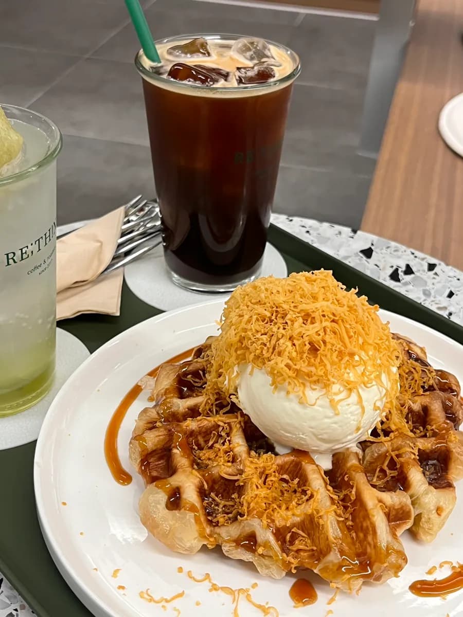 Brown cheese croffle, iced Americano, and green grape sorbet