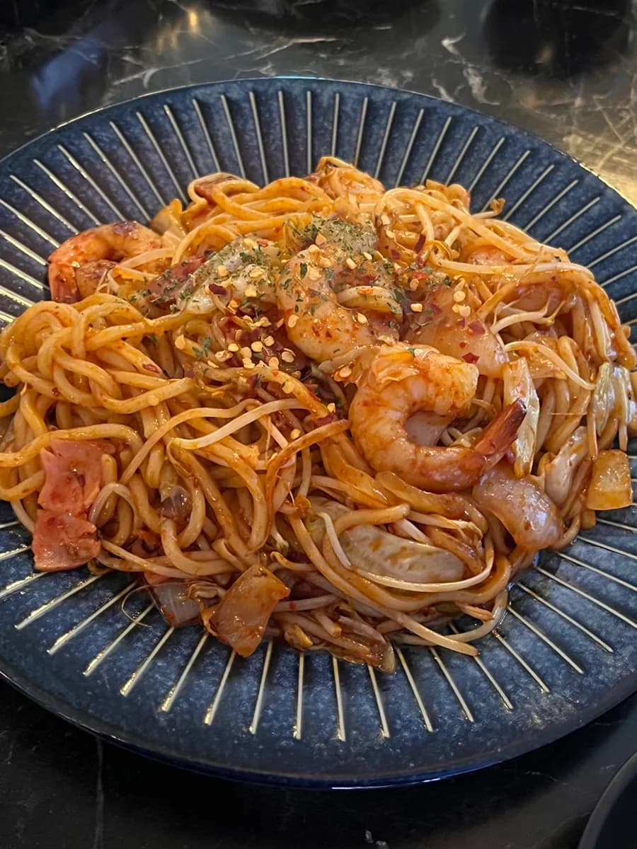 Spicy yakisoba, sundubu jjigae, and tuna mayo rice balls at Judang